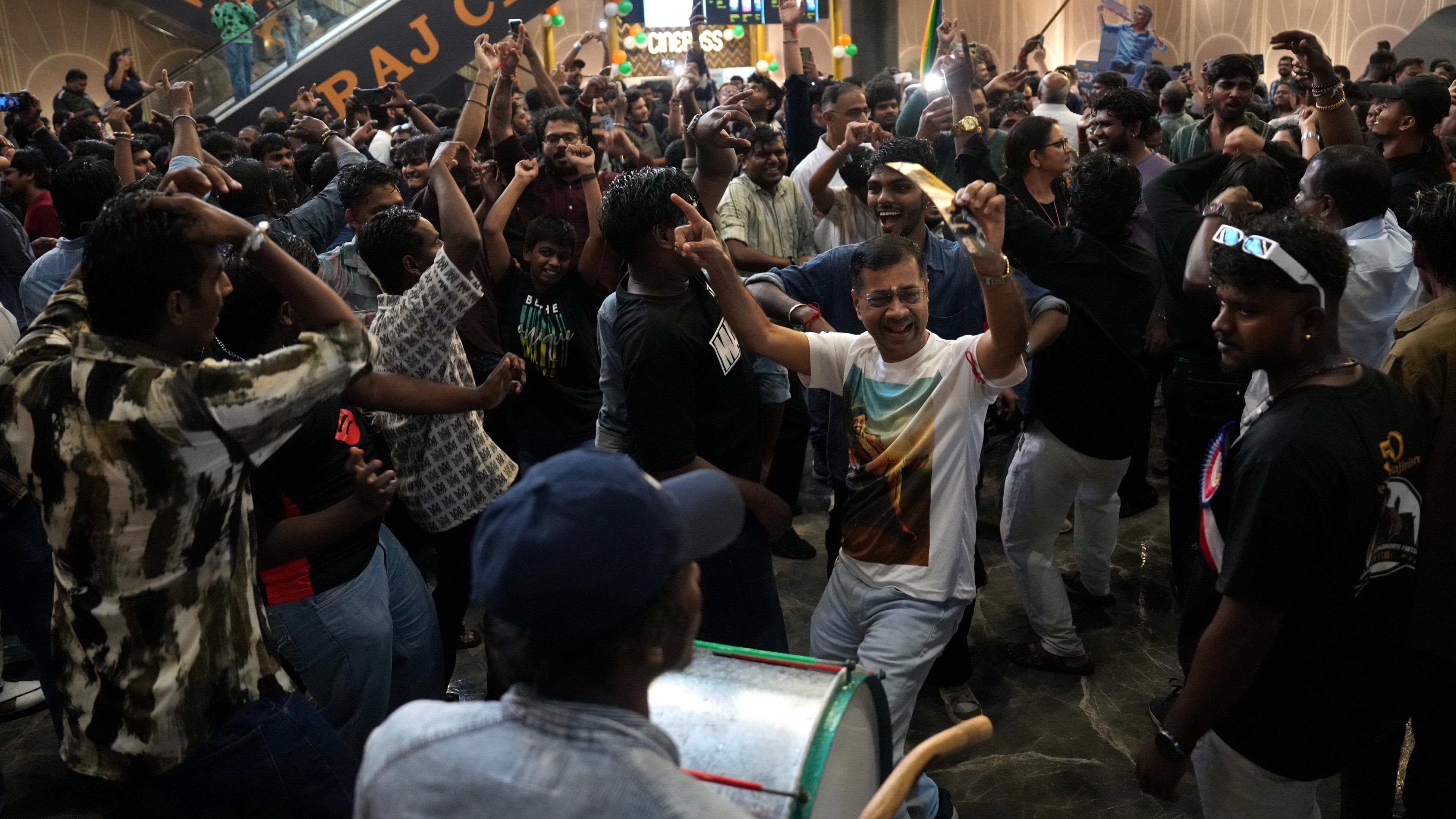 Rajini fans dance to the dhol beats as they celebrate the release of Coolie in Mumbai.