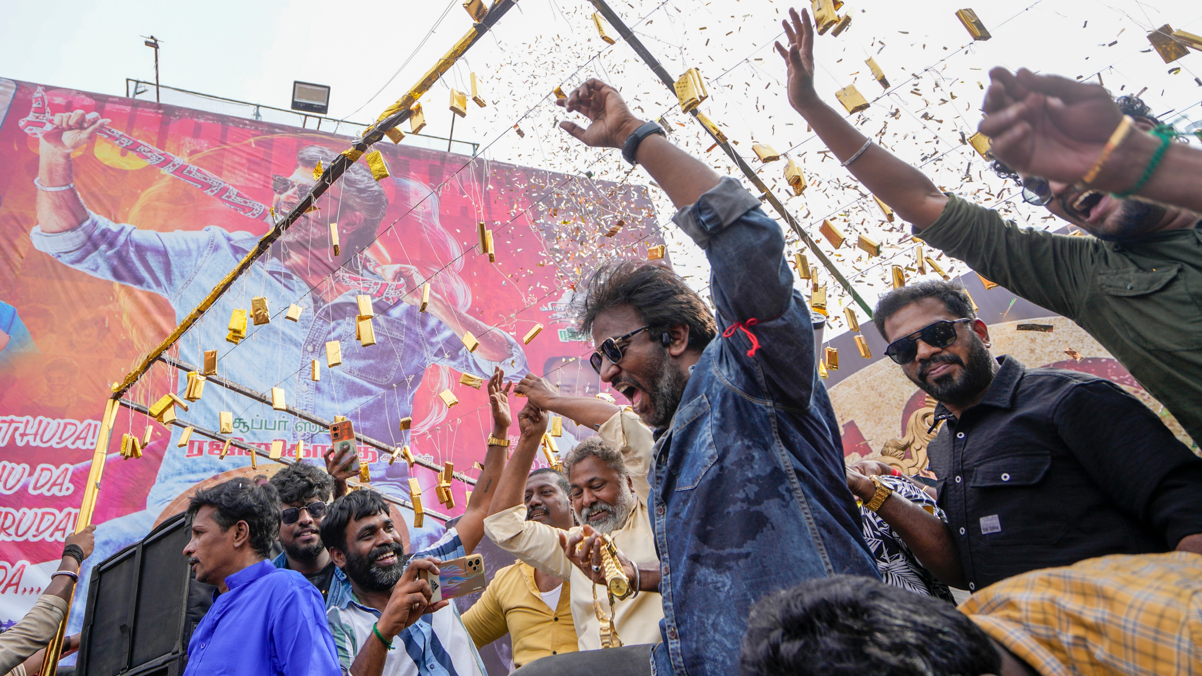 Fans dance to the dhol beats as they celebrate Thalaivar Rajinikanth's Coolie in Chennai.