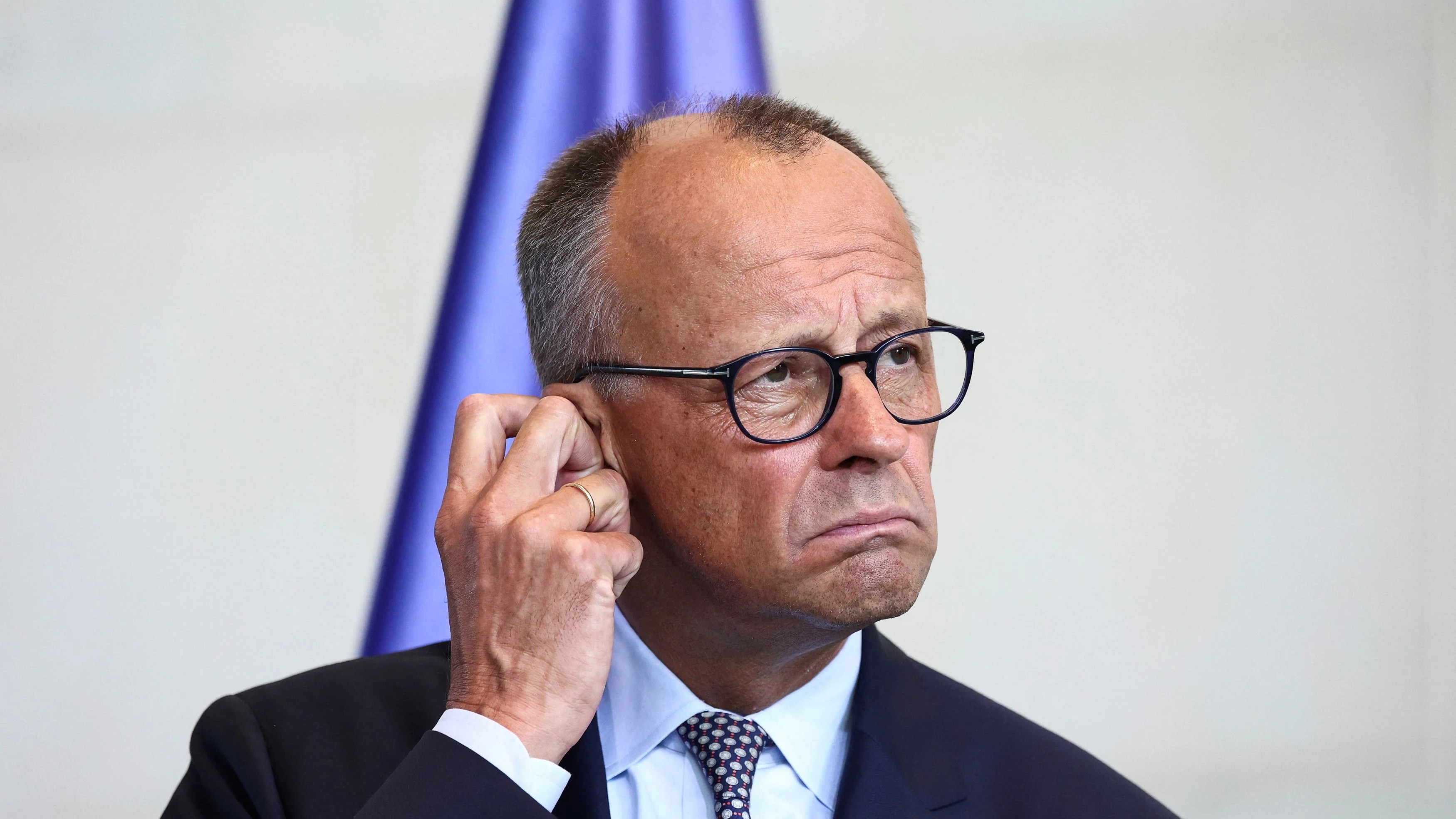 Merz faces fire over arms halt