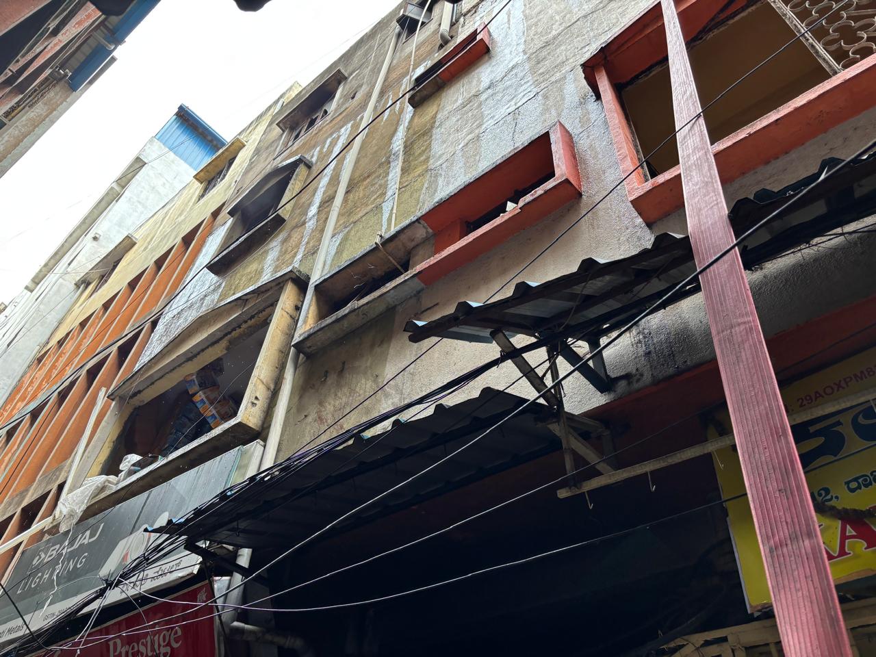 The four-storey building in Thigalarpet that caught fire on Saturday. 