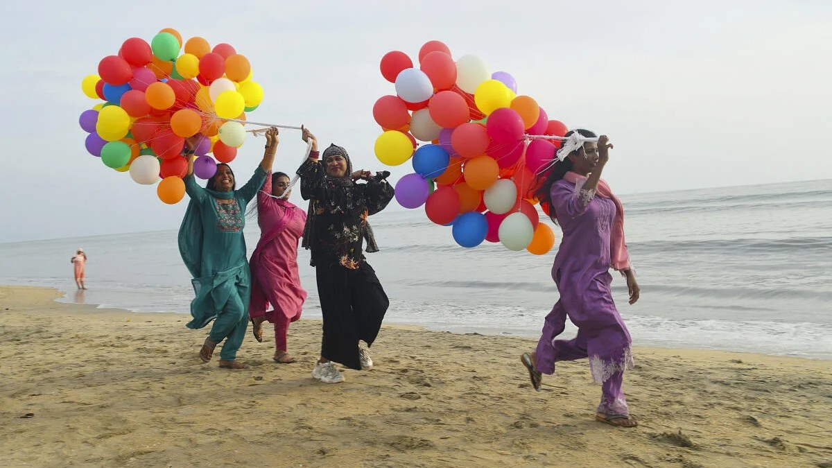 Members from transgender community take part in a cultural program, as part of promotions for the Varnapakittu transgender arts festival, at Kozhikode beach.