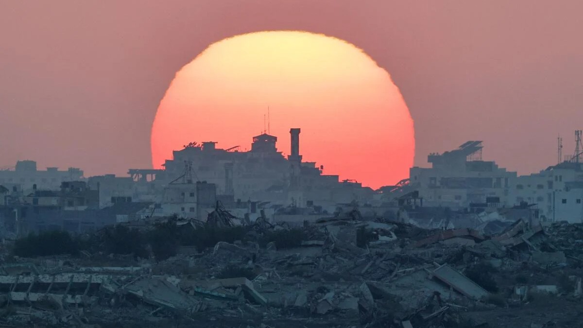 The sun sets over Gaza, as seen from the Israeli side of the border between Gaza and Israel.