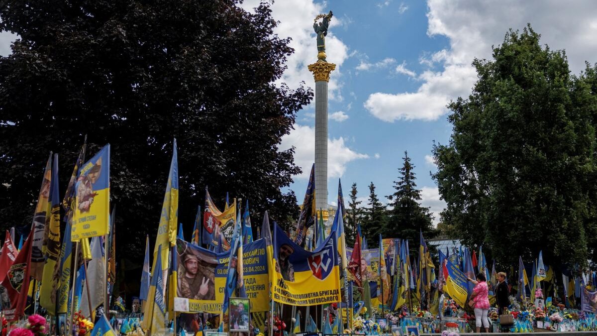 Women visit a makeshift memorial to fallen Ukrainian defenders, amid Russia's attack on Ukraine, at the Independence Square in Kyiv, Ukraine.