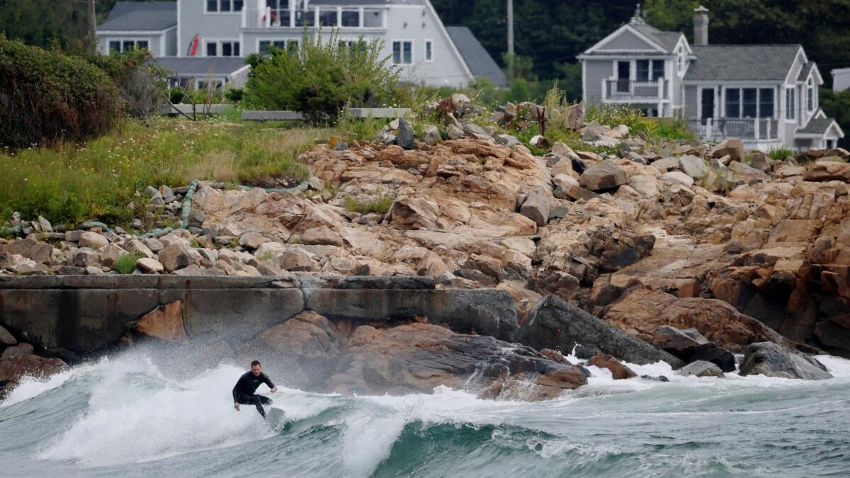 A surfer takes advantage of the waves and wind from Hurricane Erin, the first hurricane of the 2025 Atlantic season, in Rockport, Massachusetts, US.
