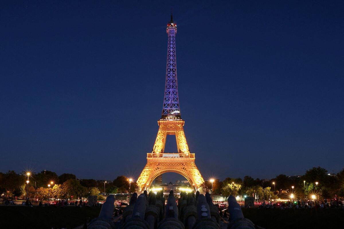 The Eiffel Tower is illuminated in the colors of Ukraine's flag to mark Ukraine's Independence Day in Paris, France, August 24, 2025.