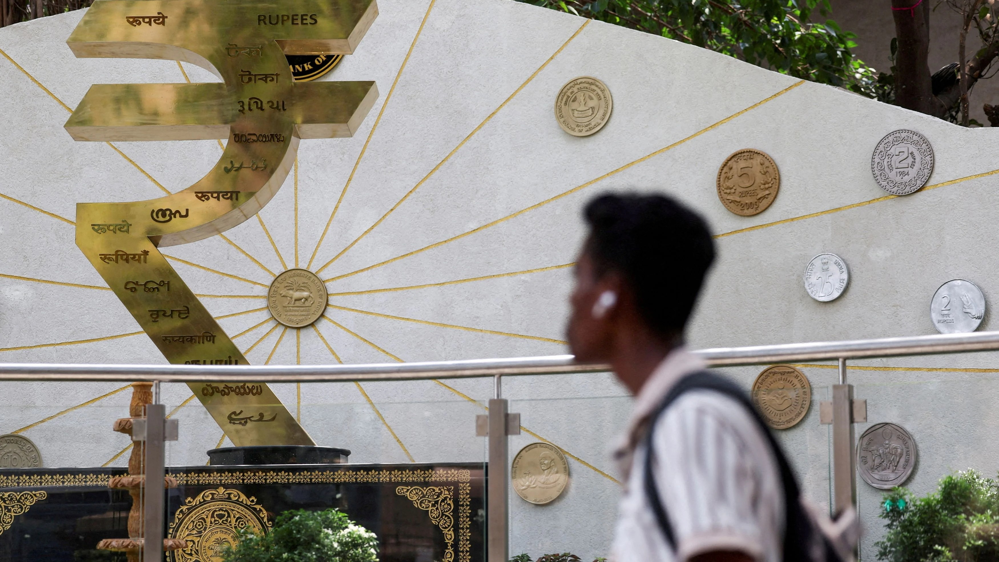 Rupee falls 12 paise to close at 87.68 against US dollar