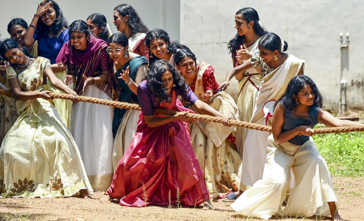 Students of Government College for Women take part in a 'tug of war' competition as part of celebrations ahead of the Onam' festival, in Thiruvananthapuram, Tuesday, Aug. 26, 2025.