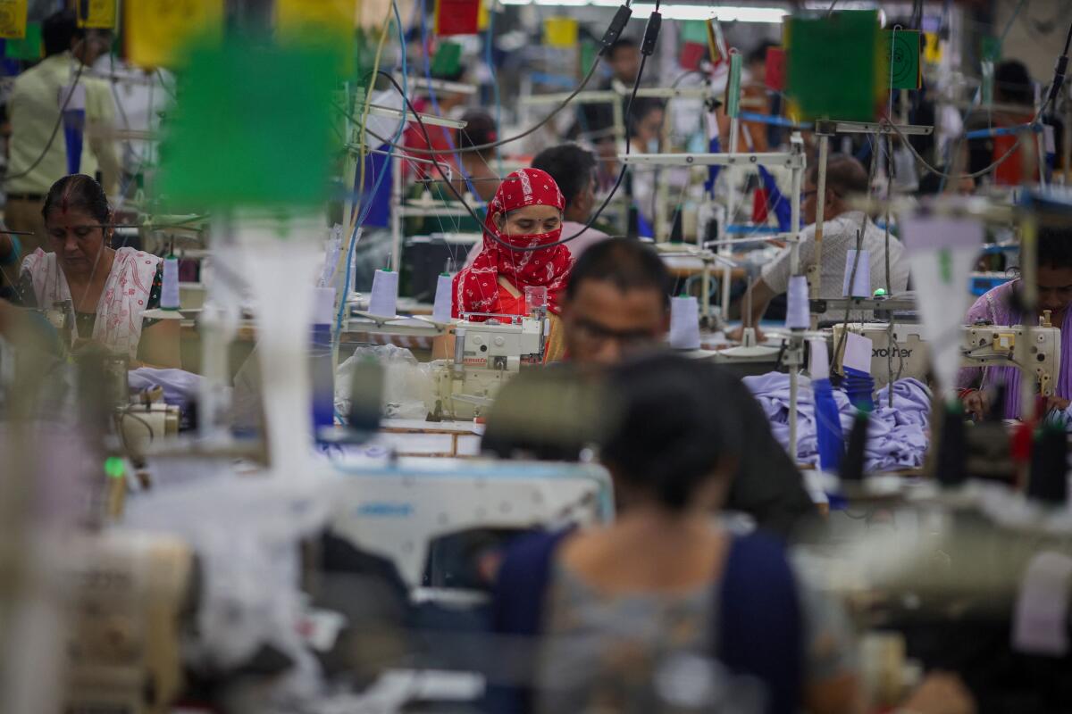 Workers at a garment manufacturing unit in Noida.