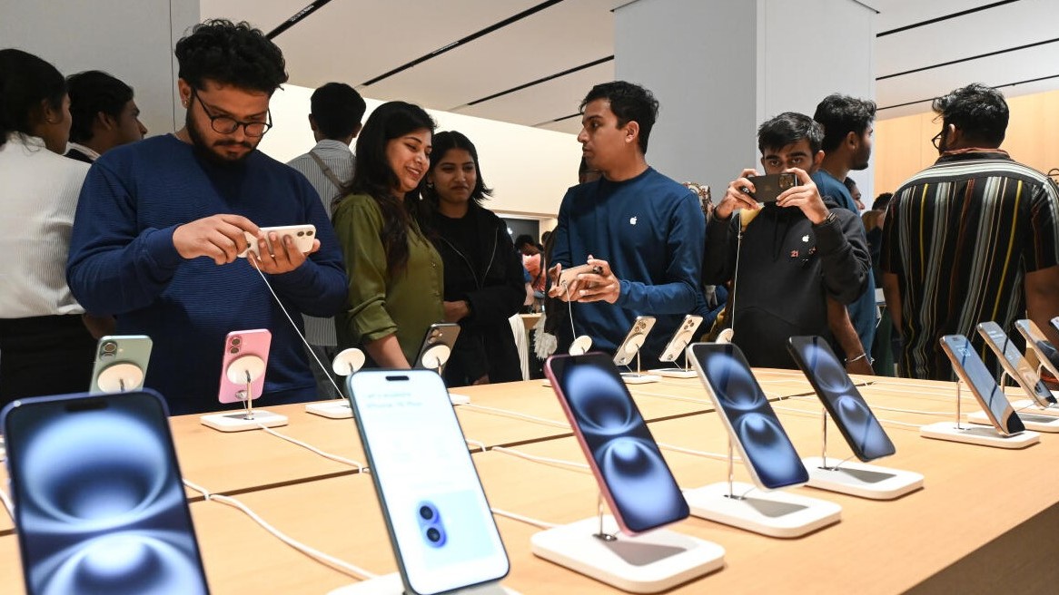 Customers checking out iPhones at the newly opened Apple Hebbal store at Phoenix Mall of Asia, in North Bengaluru on Tuesday, September 2, 2025. 