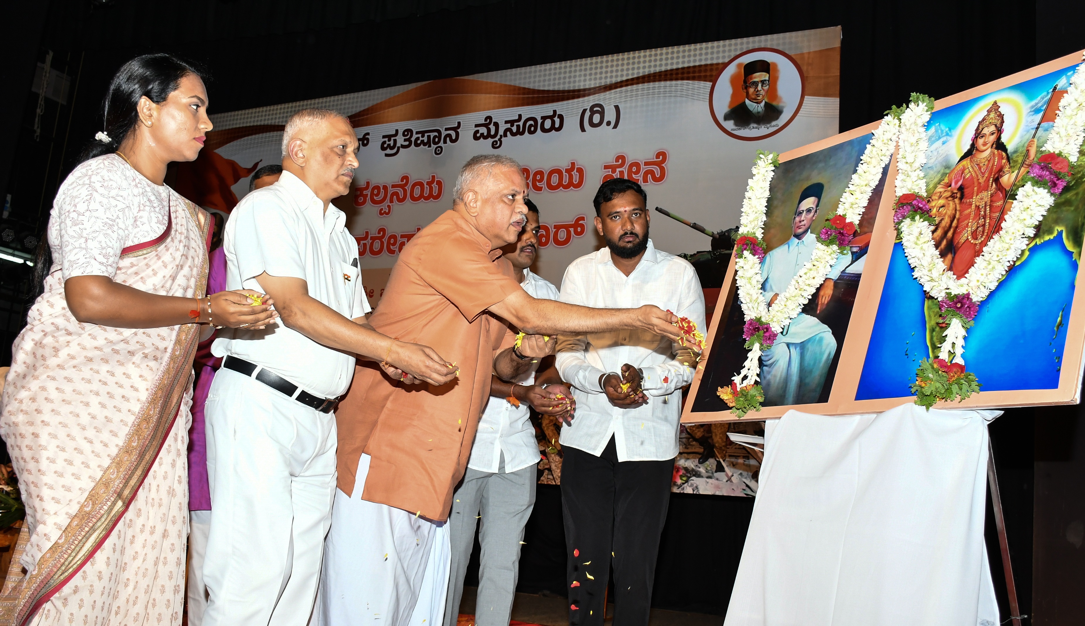 BJP General Secretary (Organising) B L Santhosh inaugurates the event before his speech on ‘Indian Army in the Vision of Savarkar and Operation Sindhoor’ in Mysuru, on Tuesday. Dr N Chandrashekar of Adithya Adhikari Hospital and Savarkar Pratishtana president and architect S Yashaswini are seen. 