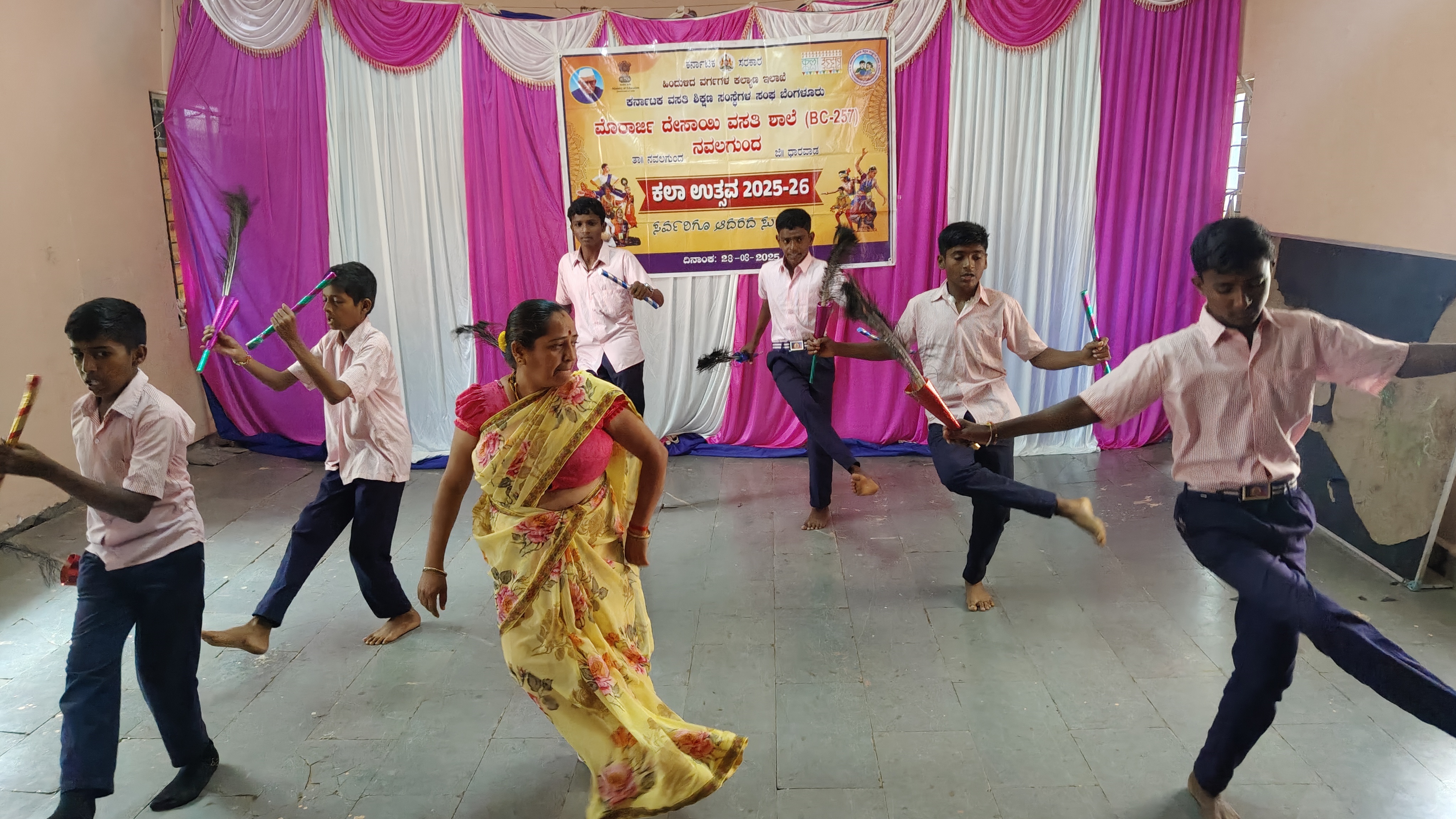 Teacher Shridevi Pujar teaches Halakki Kunita to students in Navalgund.