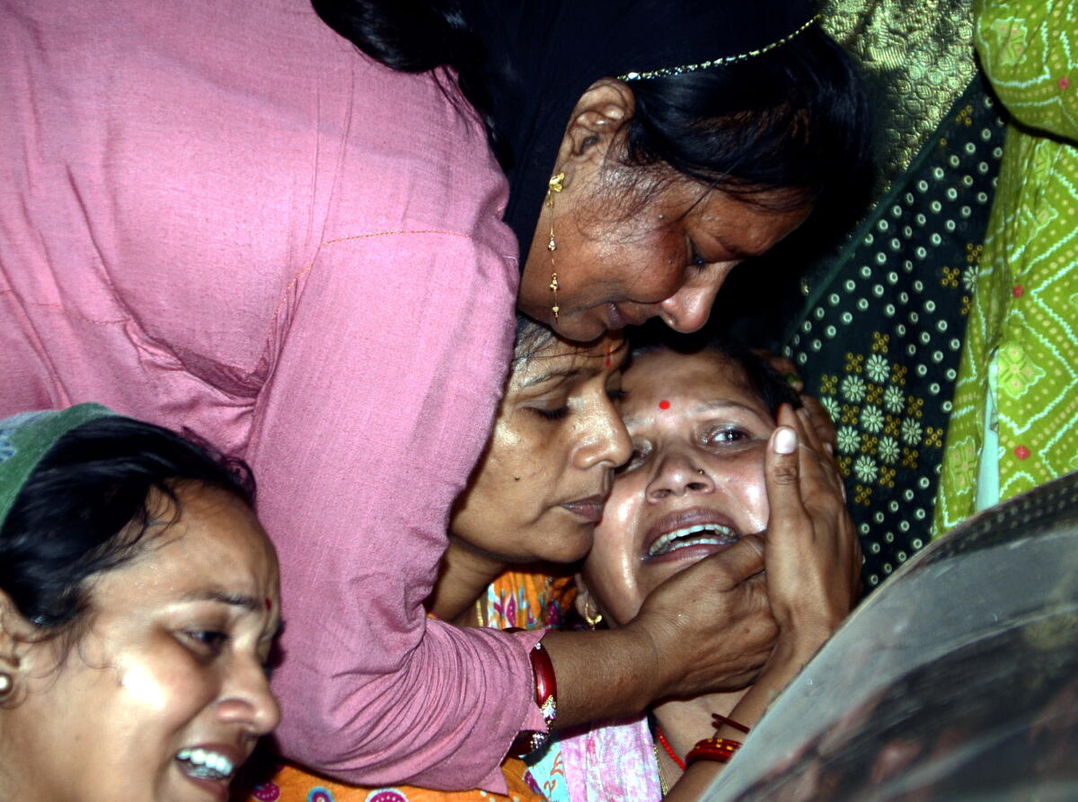 Kanpur: Family members of a victim mourn after an alleged collision between a high-speed car and a truck, on the Purvanchal expressway.