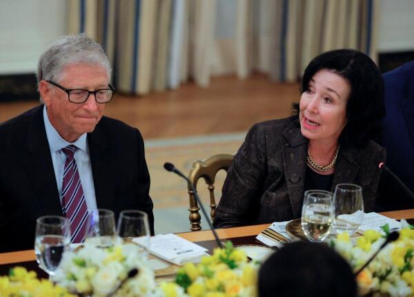 Oracle CEO Safra Catz and Microsoft cofounder Bill Gates attend a private dinner for technology and business leaders hosted by U.S. President Donald Trump in the State Dining Room at the White House in Washington, D.C.