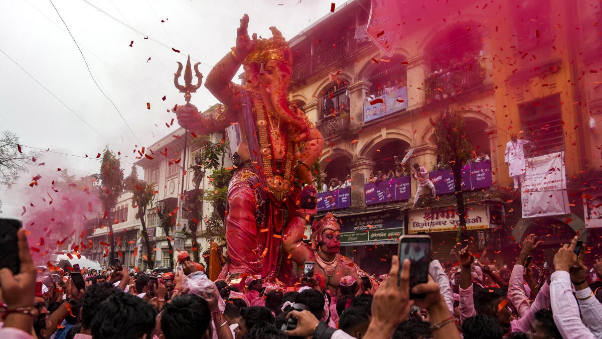 Mumbai dances to 'dhol-tasha' as immersion processions of Ganesh idols begin amid rains
