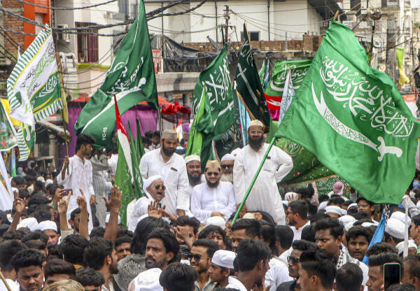 People from the Sunni Muslim community take part in a 'Madh-e-Sahaba' procession on the occasion of the ‘Eid-e-Milad-Un-Nabi’ festival, which marks the birth anniversary of Prophet Muhammad, in Lucknow.