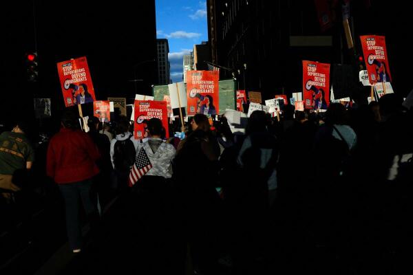 Protesters march through downtown Chicago after U.S. President Donald Trump ordered an increased federal law enforcement presence to assist with crime prevention.