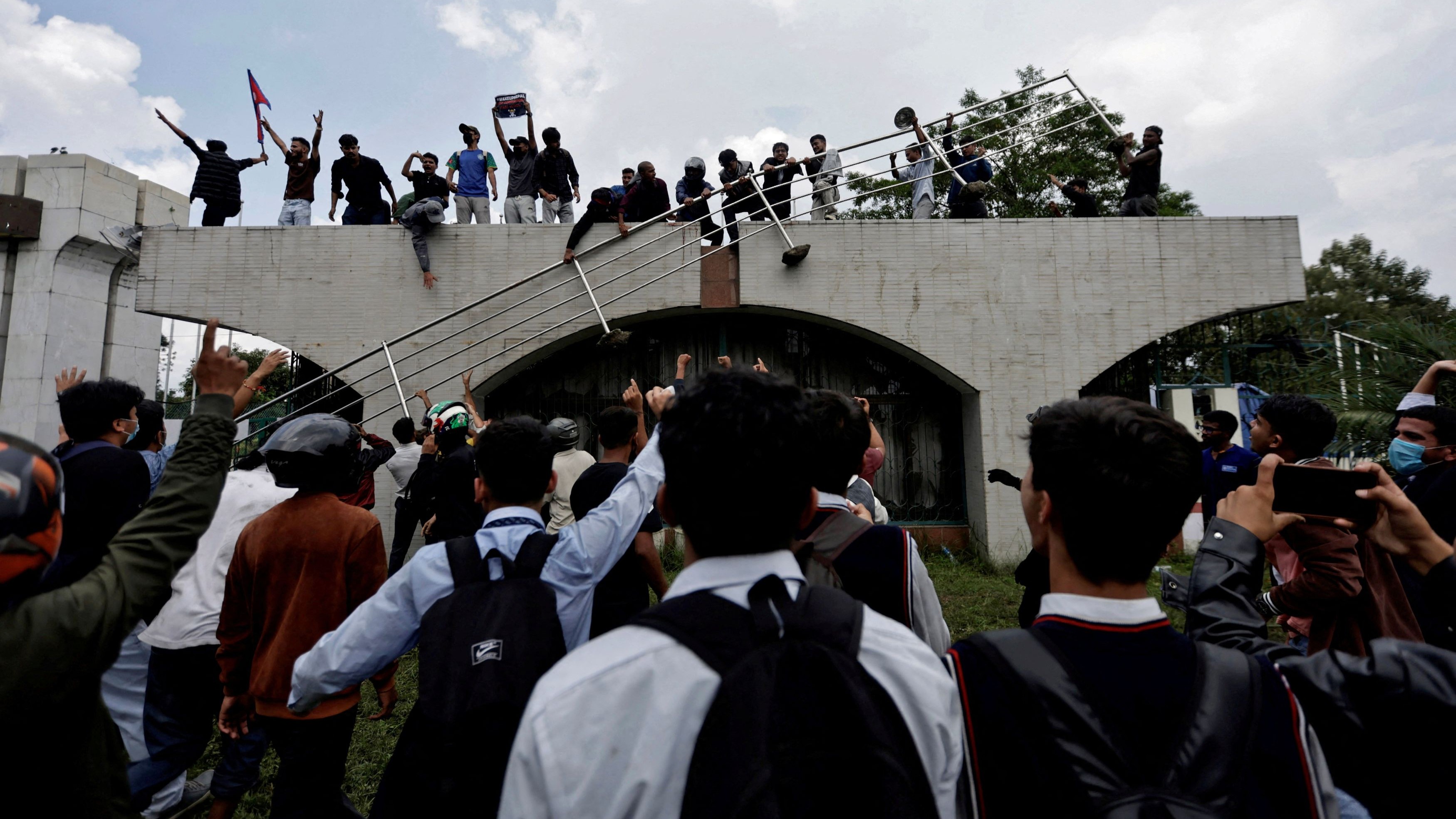 Demonstrators gather at the entrance of the Parliament during a protest against corruption and the government’s decision to block several social media platforms in Kathmandu, Nepal.