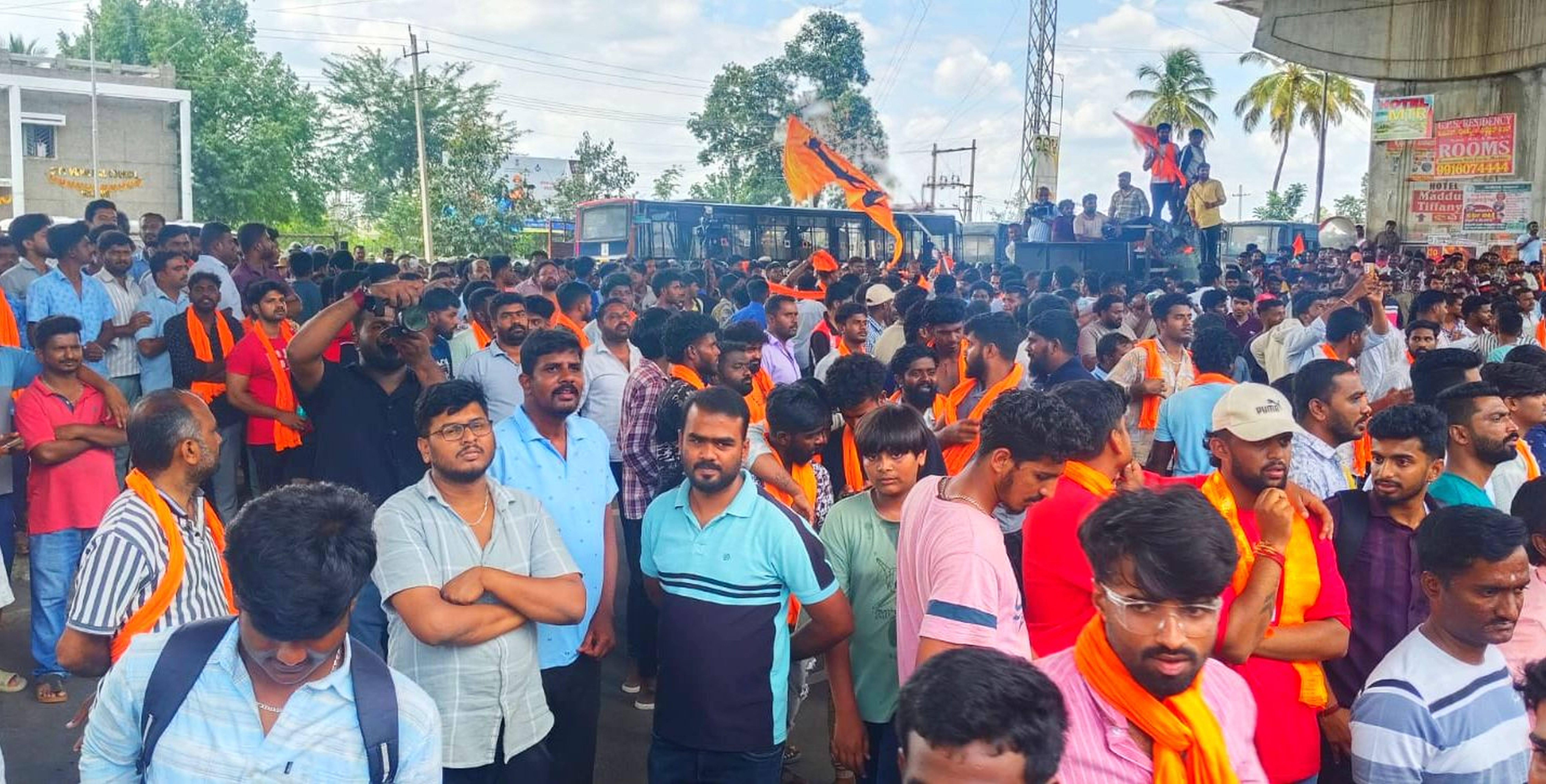 Thousands of people belonging to various Hindu outfits take out a protest march condemning the stone pelting incident in Maddur town on Monday. 