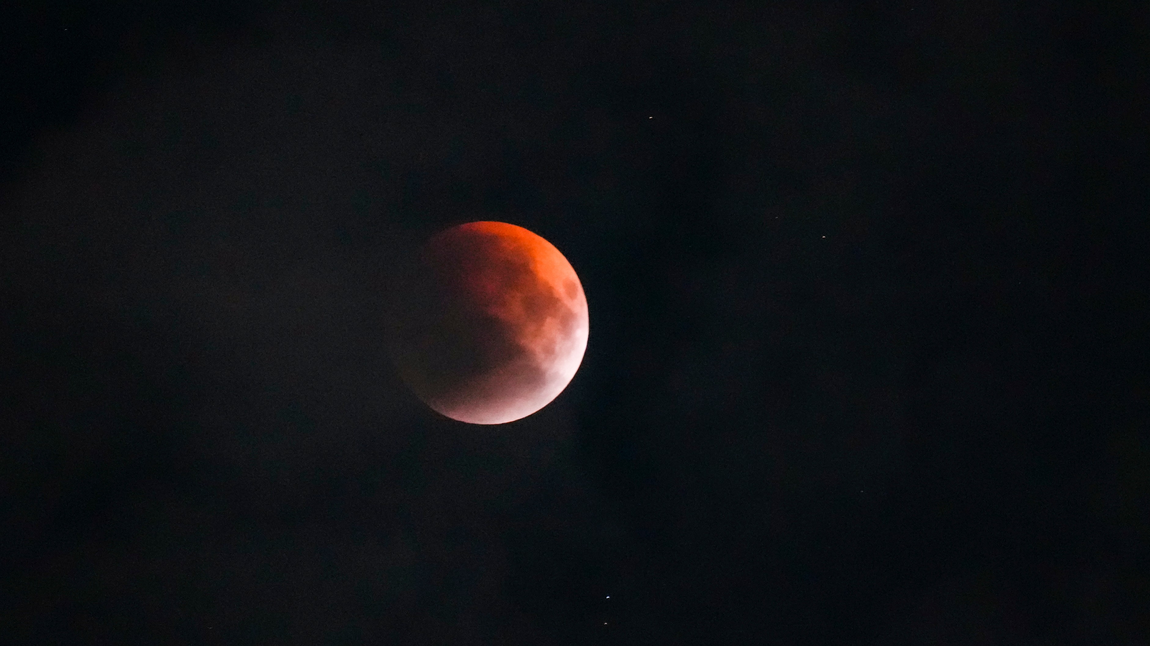 The blood moon appears during the lunar eclipse in New Delhi.