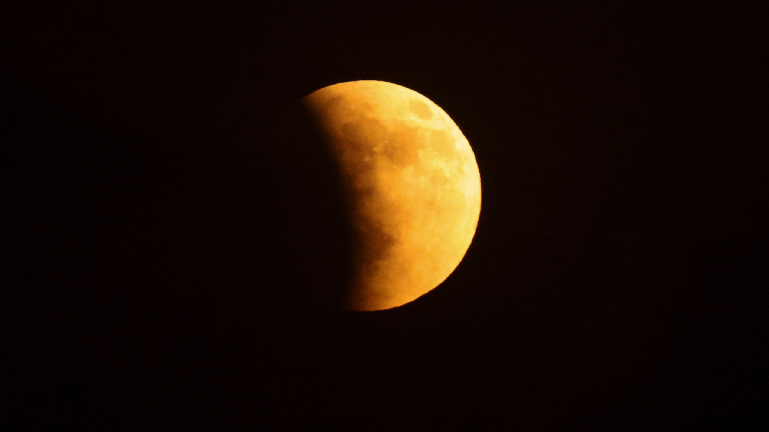 During a 'Blood Moon' total lunar eclipse in Cairo, Egypt, the Moon turned red as it passed through the Earth's shadow cast by the Sun.