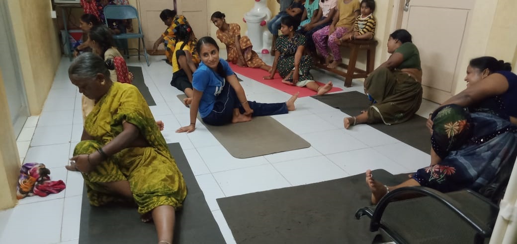 Senior citizens practise yoga under the guidance of Sudha Patil.