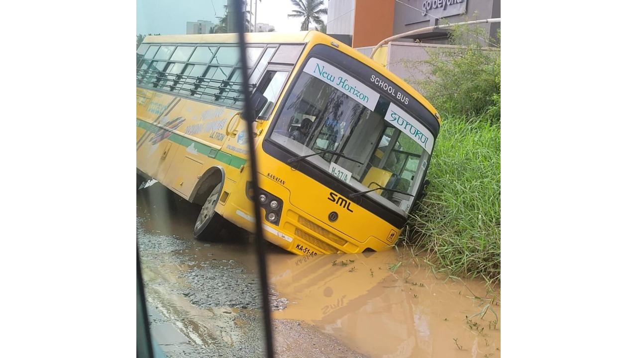 Bus carrying children tilts on Balagere-Panathur road in Bengaluru due to potholes, water-logging; no injuries reported 