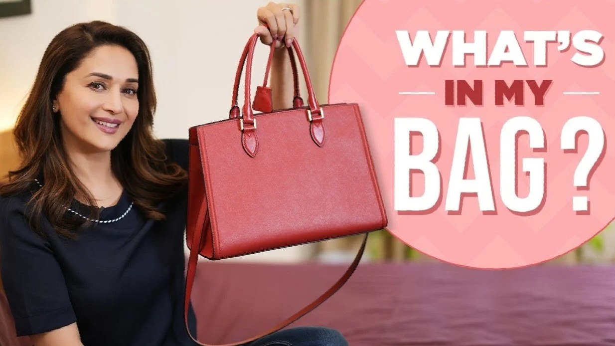 From a toilet seat sanitiser to a photo of husband Dr Shriram Nene, what’s inside Madhuri Dixit’s bag is winning the internet