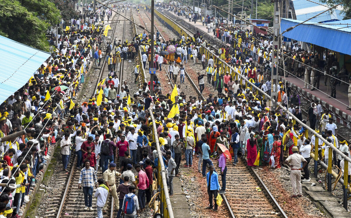 Members of the Kurmi community block railway tracks during a protest demanding Scheduled Tribe status, at Muri railway station, in Ranchi district, Jharkhand.