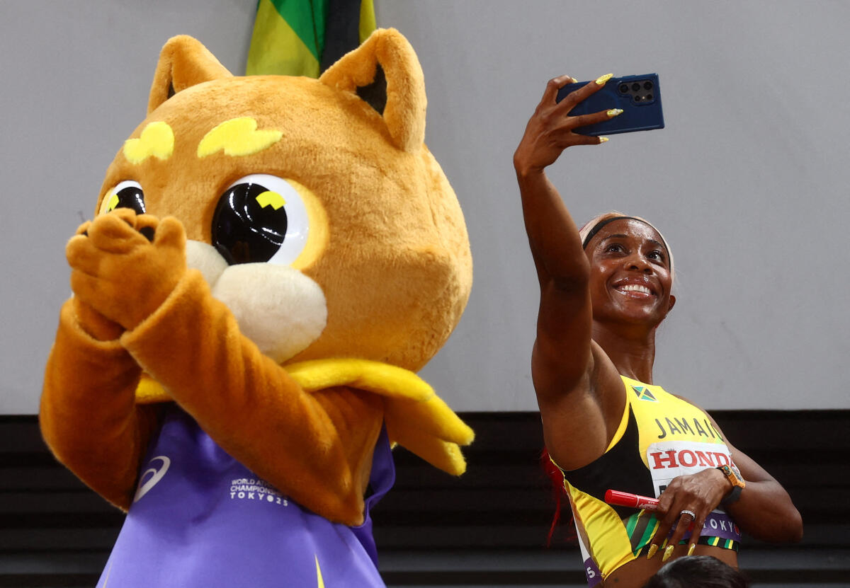 Silver medallist Jamaica's Shelly-Ann Fraser-Pryce celebrates after finishing second in the Women's 4 x 100m Relay Final.