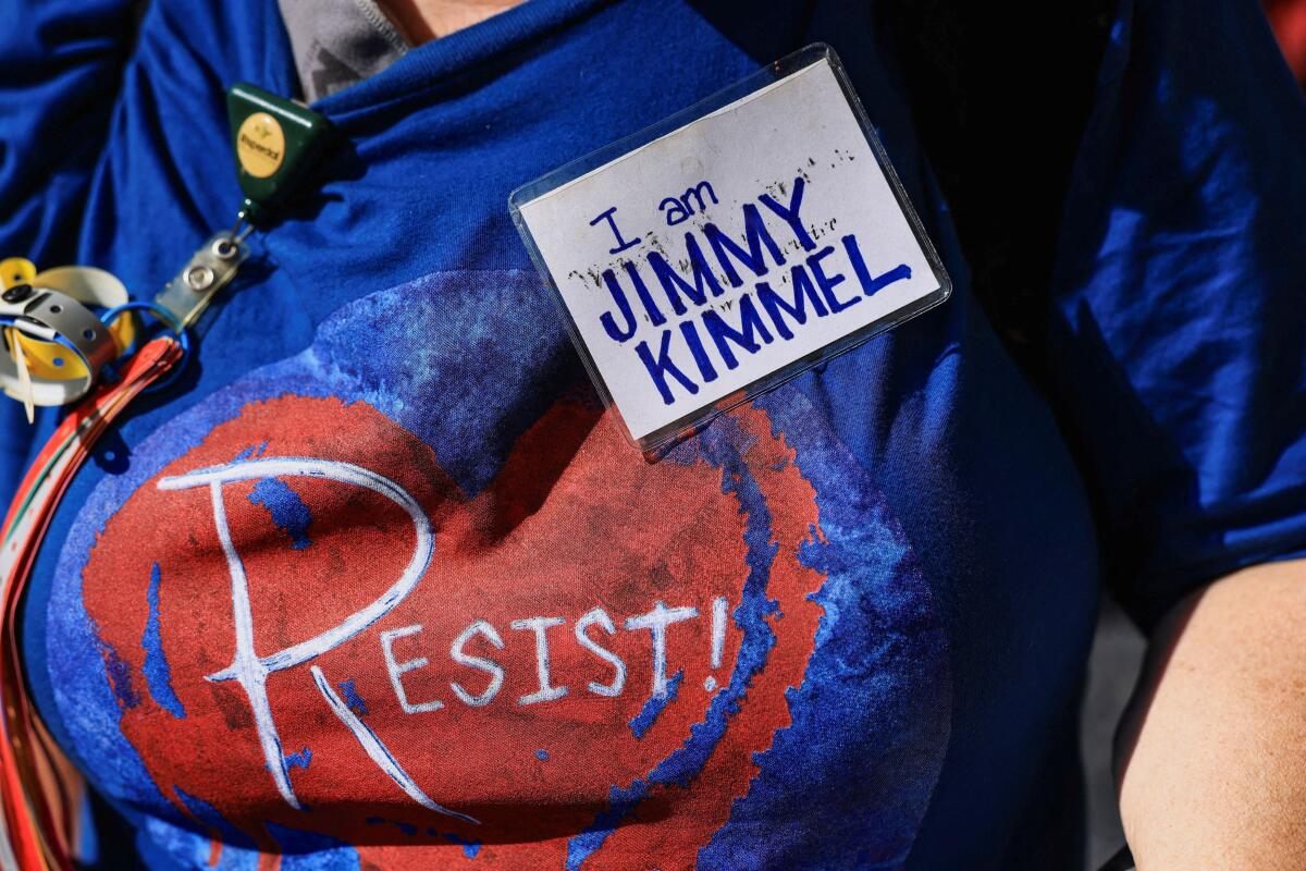 A demonstrator wears a small sign reading "I am Jimmy Kimmel" during a protest outside the Dolby Theatre, across the street from the theater where "Jimmy Kimmel Live!" was recorded for broadcast, following his suspension for remarks he made regarding Charlie Kirk’s assassination, on Hollywood Boulevard in Los Angeles, California, US.
