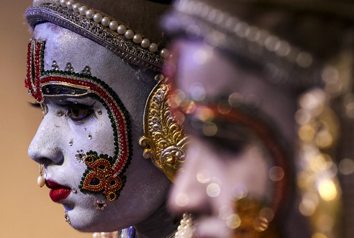 An artist dressed as Lord Ram to take part in the 'Ram Barat' religious procession ahead of 'Dussehra' festival, in Prayagraj.