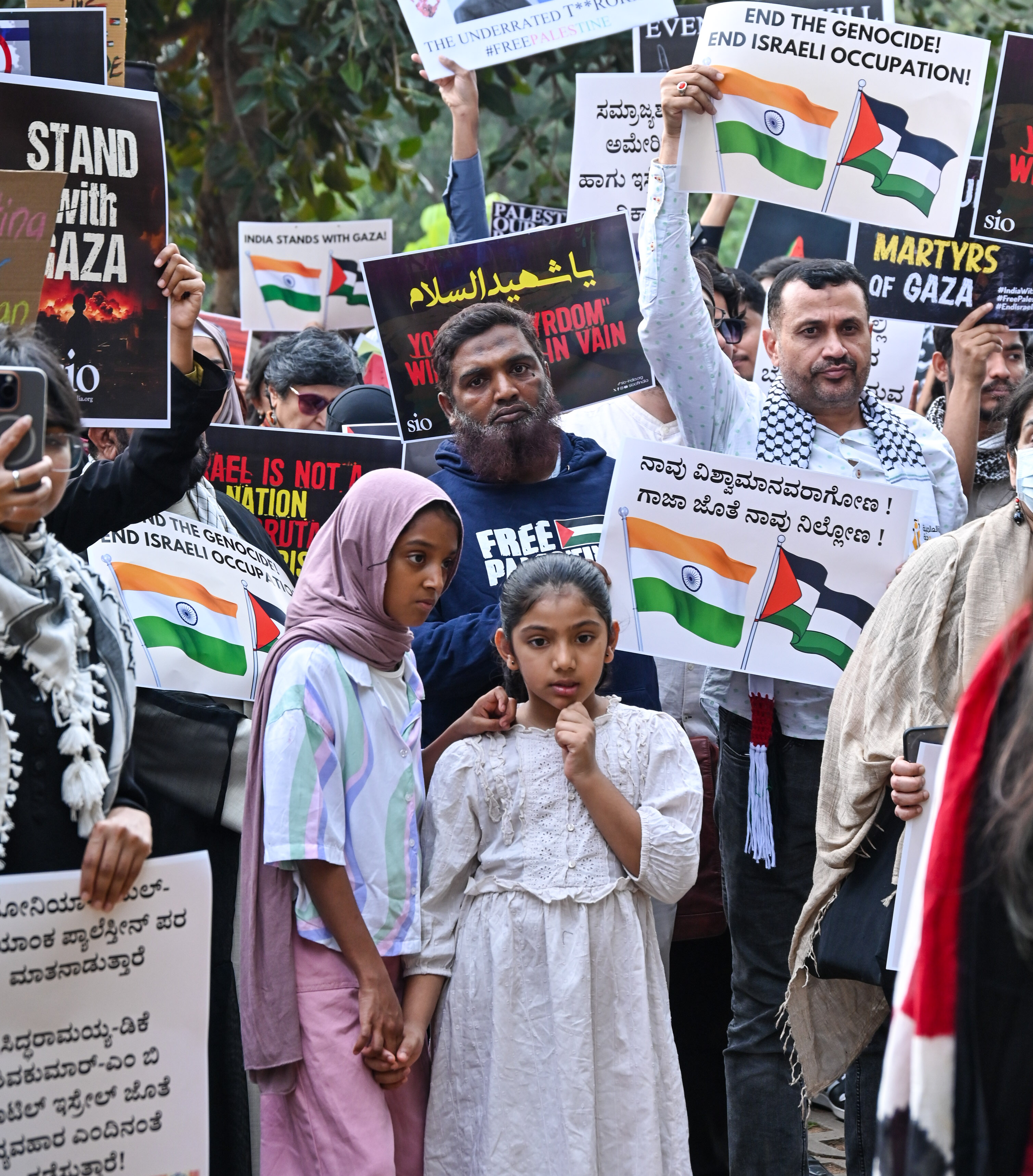 Hundreds gathered at Freedom Park in Bengaluru on Friday to protest in solidarity with Palestine. Around 300 people of all ages and backgrounds participated holding placards delivering speeches reciting poetry singing and even selling artwork to raise funds for charity. 