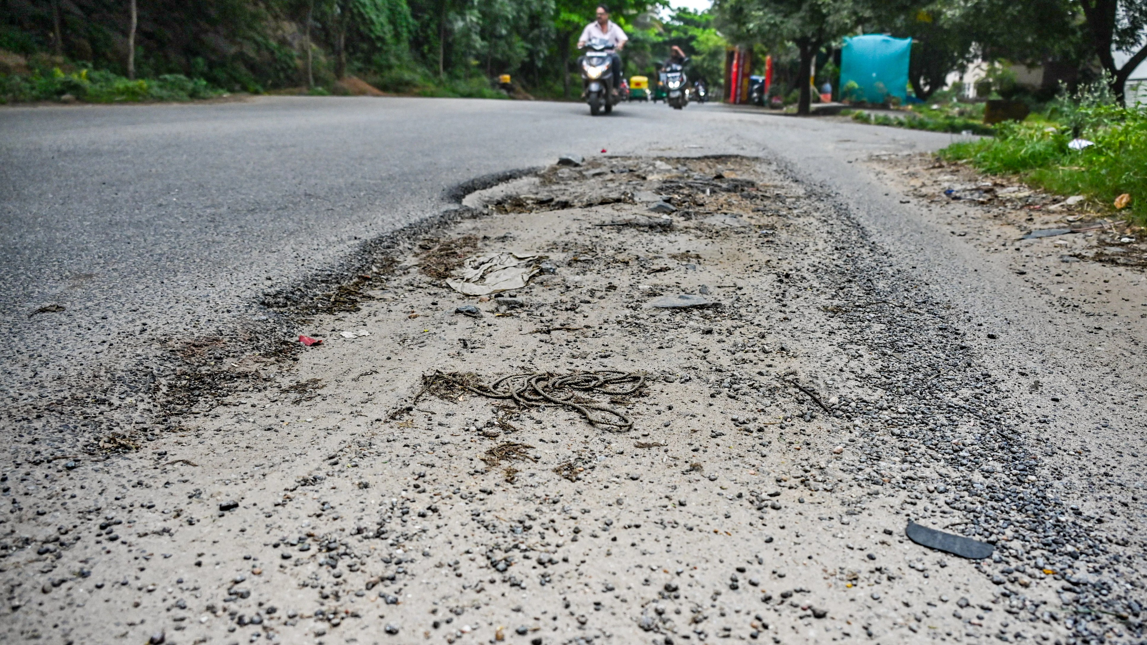 Bengaluru's R R Nagar commuters struggle on cratered roads