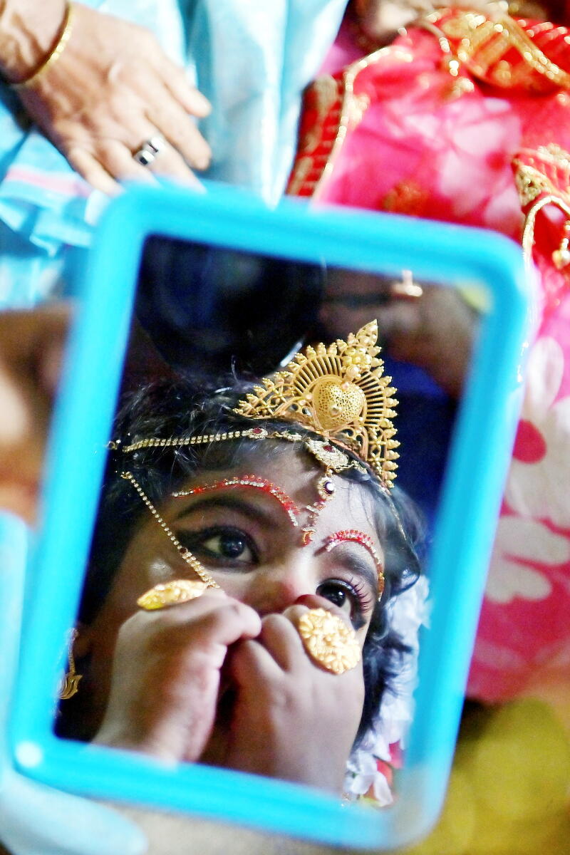 A girl dressed up for 'Kumari Puja' on 'Maha Ashtami' during the 'Durga Puja' festival, in Agartala