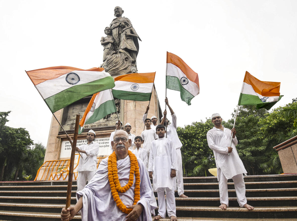 Artistes dressed as Mahatma Gandhi and his followers enact a scene from his life on 'Gandhi Jayanti', his birth anniversary, at Gandhi Maidan, in Patna, Bihar