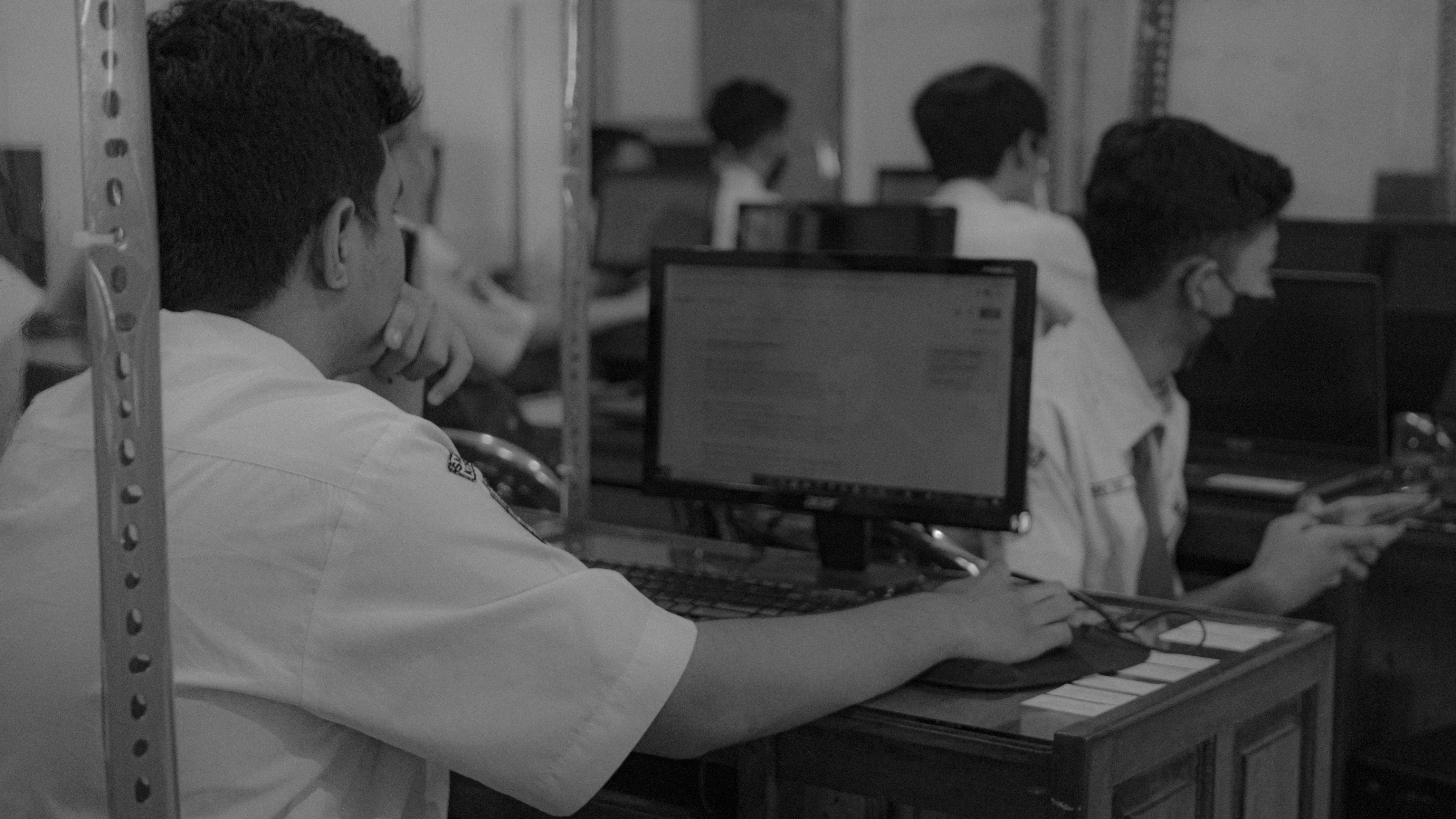Image of a person assessing a digital report for representative purposes.