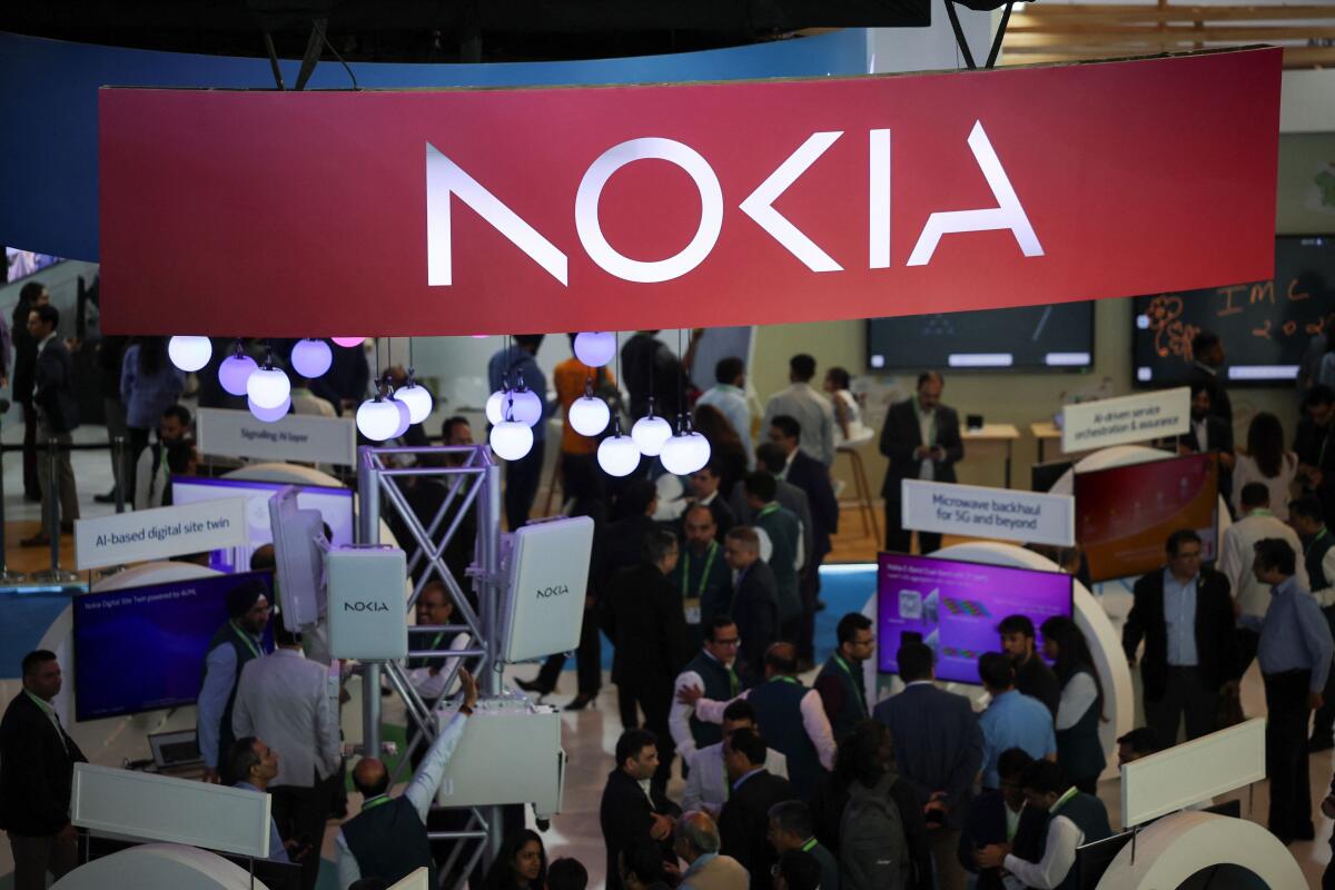 People visit at the Nokia exhibitor stall at the ongoing India Mobile Congress 2025 at Yashobhoomi, a convention and expo center in New Delhi, India.