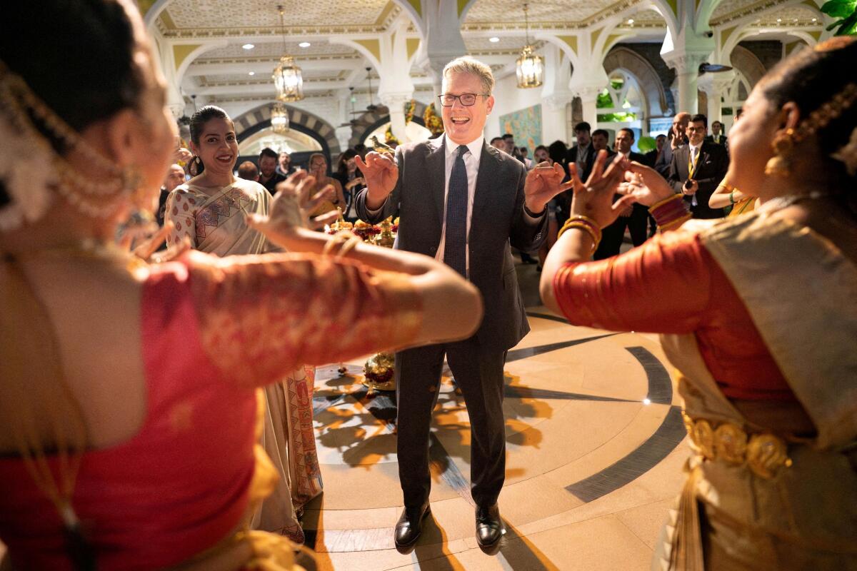 British Prime Minister Keir Starmer attends a ceremony to celebrate the approaching Diwali festival, during his visit to India, in Mumbai, India.