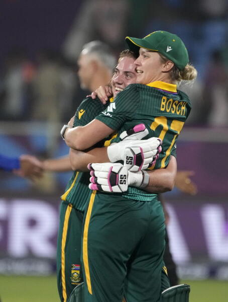 South Africa's Nadine de Klerk celebrates with teammate Anneke Bosch after South Africa won the ICC Women's World Cup 2025 ODI cricket match against India, at the ACA-VDCA Cricket Stadium, in Visakhapatnam, Thursday, Oct. 9, 2025.