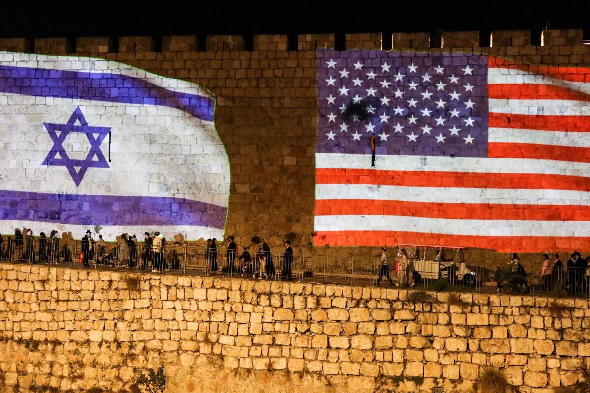 United States and Israel flags are projected on the walls of the Old city of Jerusalem in celebration after Israel and Hamas agreed to the first phase of U.S. President Donald Trump's plan to end the war in Gaza. Credit: Reuters