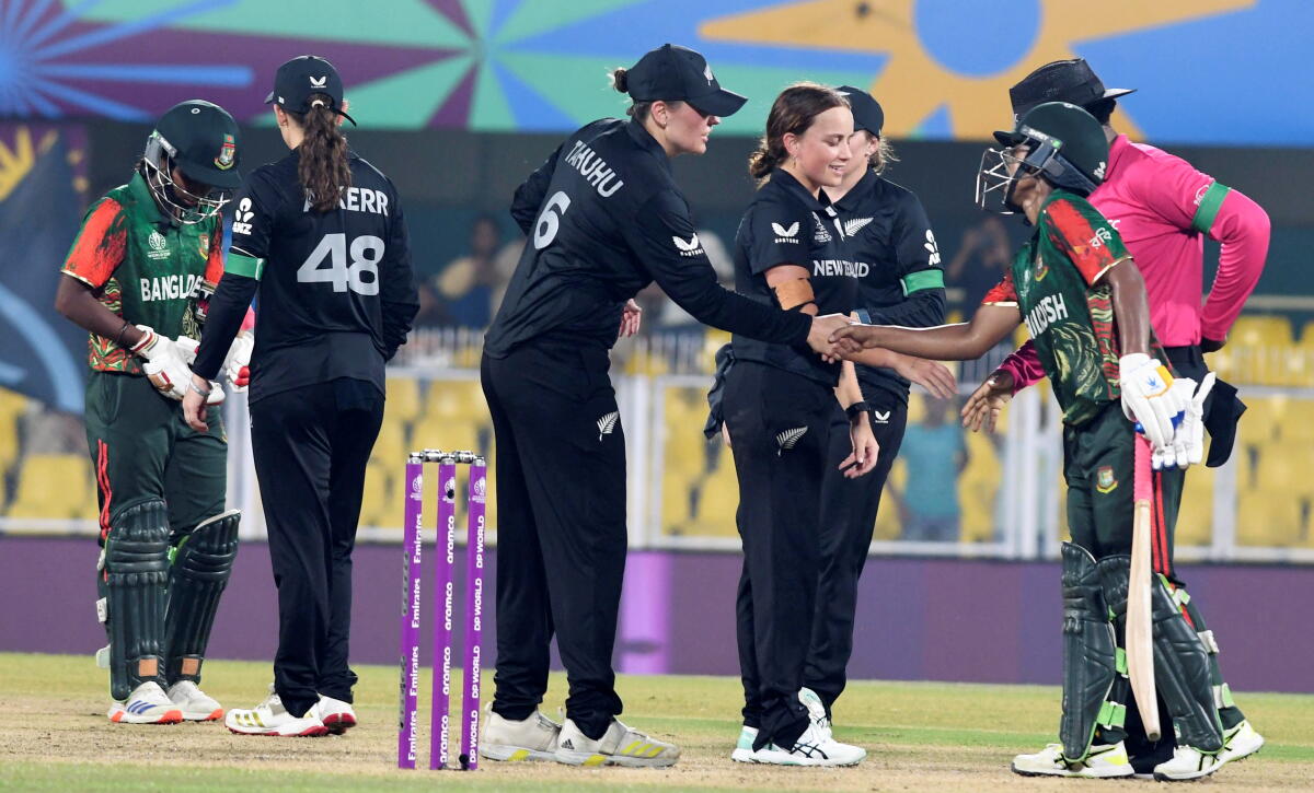 Players of New Zealand and Bangladesh greet each other at the end of their ICC Women's World Cup 2025 ODI cricket match, at ACA Stadium, Barsapara in Guwahati, Friday, Oct. 10, 2025. New Zealand won by 100 runs.
