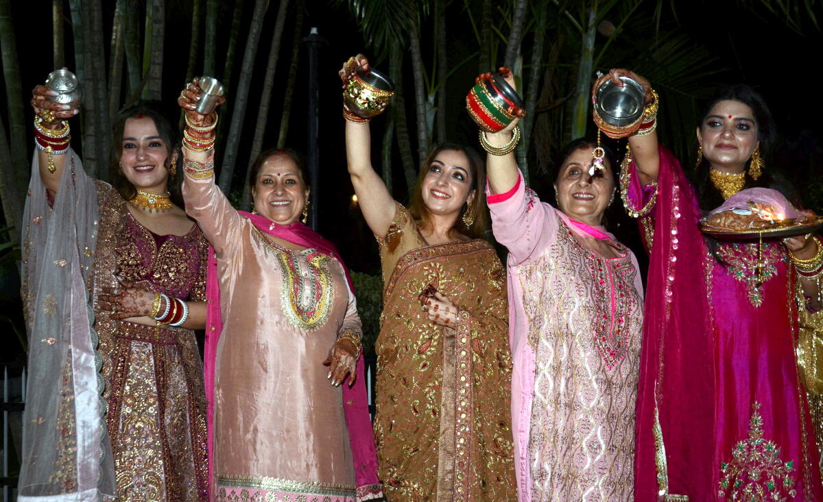 Women perform rituals on the occasion of 'Karva Chauth', in Jammu.