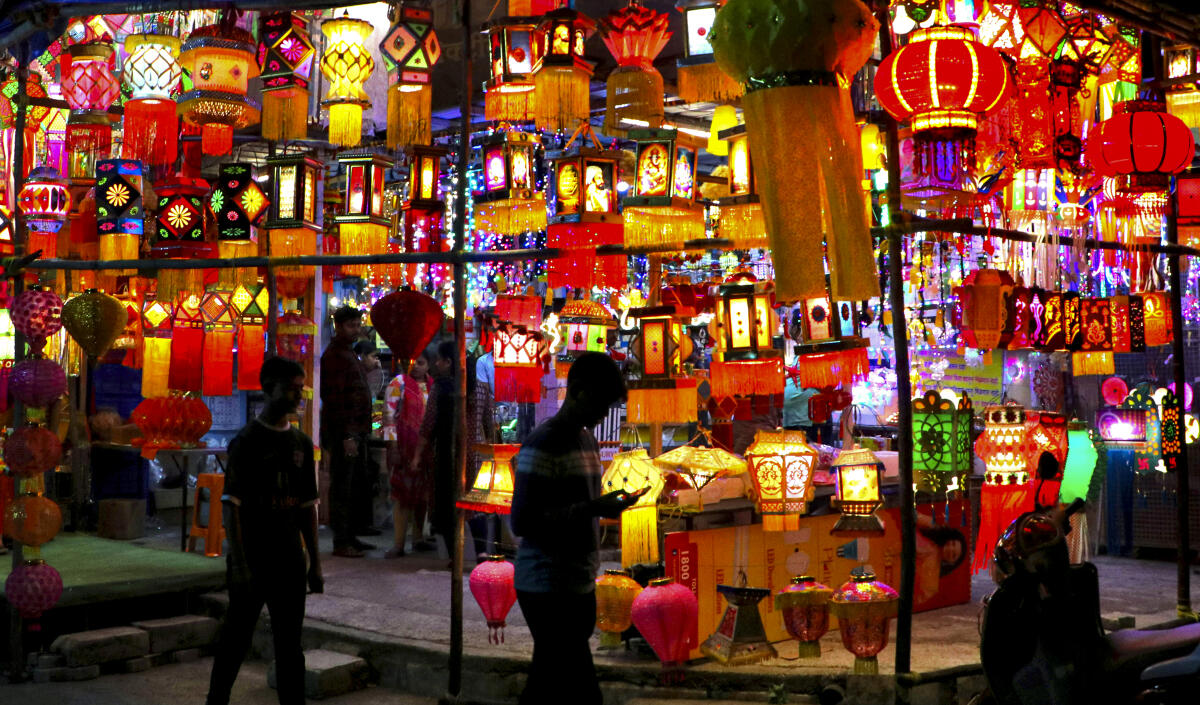People shop for lanterns ahead of the 'Diwali' festival, in Nagpur.