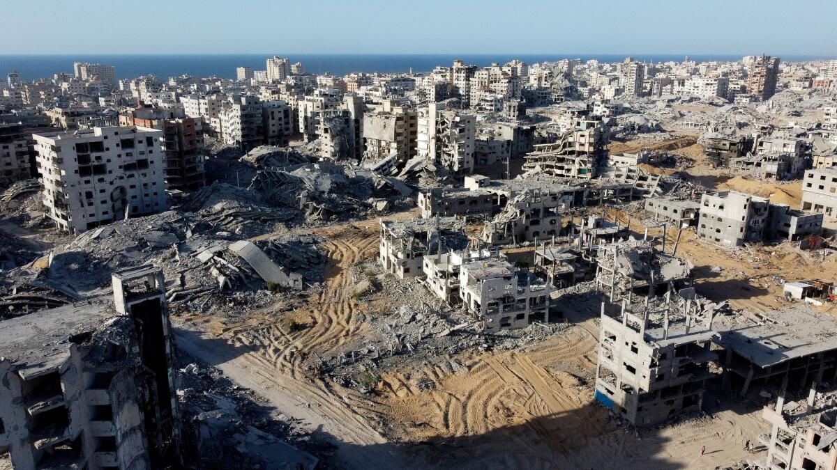 A drone view shows the destruction in a residential neighborhood, after the withdrawal of the Israeli forces from the area, amid a ceasefire between Israel and Hamas in Gaza, in Gaza City.
