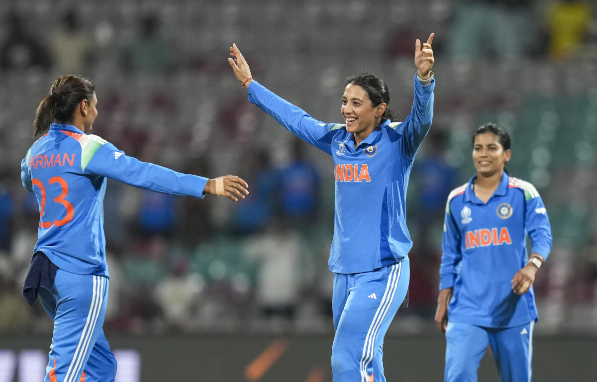 India's captain Harmanpreet Kaur with teammate Smriti Mandhana celebrates the wicket of New Zealand’s Jess Kerr during an ICC Women's World Cup ODI cricket match between India Women and New Zealand Women, at the DY Patil Stadium, in Navi Mumbai.