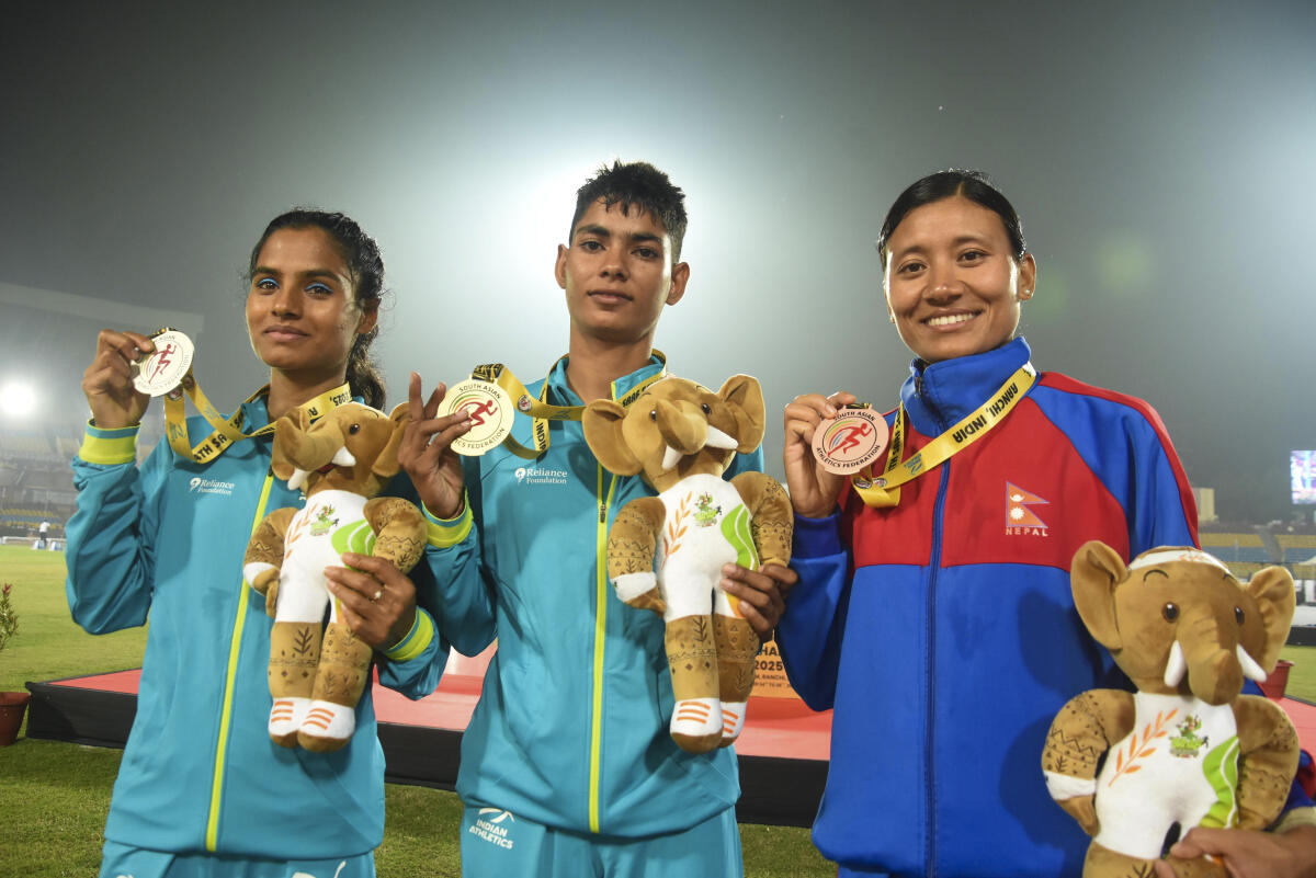 Gold medallist India's Sanjana Singh, silver medallist India's Seema and bronze medallist Nepal's Santoshi Shrestha during the felicitation ceremony after the Women's 5000 meter run at the 4th South Asian (SAAF) Senior Athletics Championships, in Ranchi.