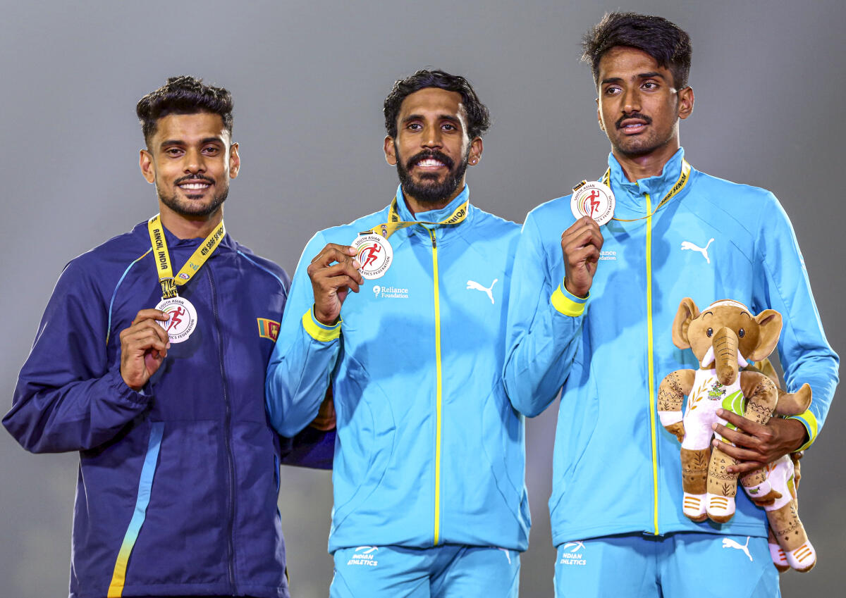 From left, silver medalist Sri Lanka’s Ranatungage Roshan, gold medalist India’s R Manav and the latter’s bronze medalist compatriot M Krishik during the presentation ceremony of the men’s 110m hurdles at the 4th South Asian (SAAF) Senior Athletics Championships, at Birsa Munda Athletics Stadium, in Ranchi, Jharkhand.
