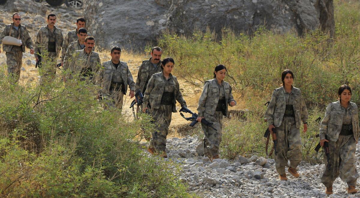 Fighters with the Kurdistan Workers' Party (PKK) walk for a disarmament ceremony marking a significant step toward ending the decades-long conflict between Turkey and the outlawed group, in the Qandil mountains, Iraq.