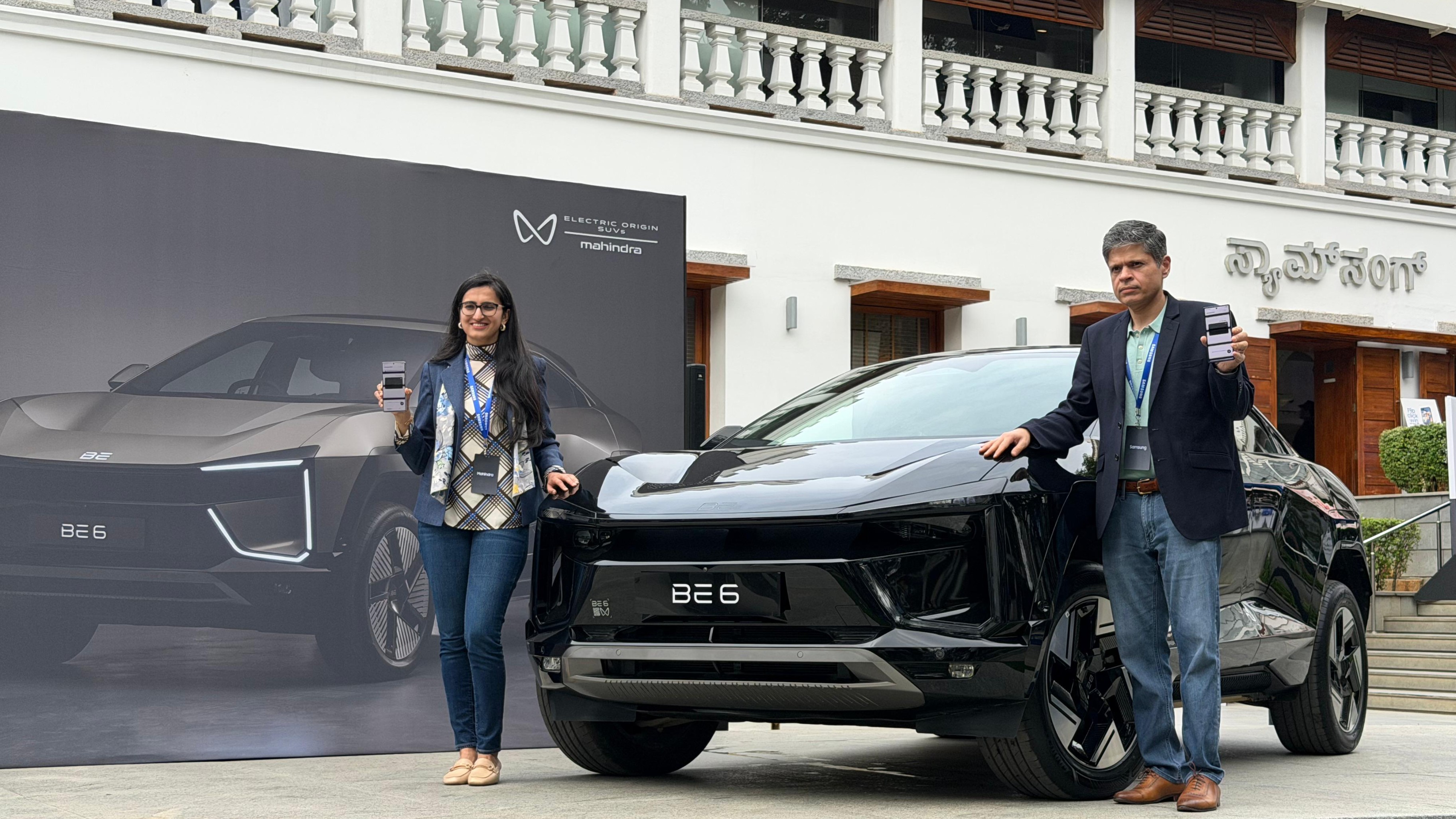 Madhur Chaturvedi, Senior Director, Services &amp; Apps Business, Samsung India (right), along with Shruti Agarwal, Head of Product Planning &amp; ESG, Mahindra Electric, announcing the rollout of Digital Car Key at Samsung Opera House, Bengaluru on October 29, 2025.