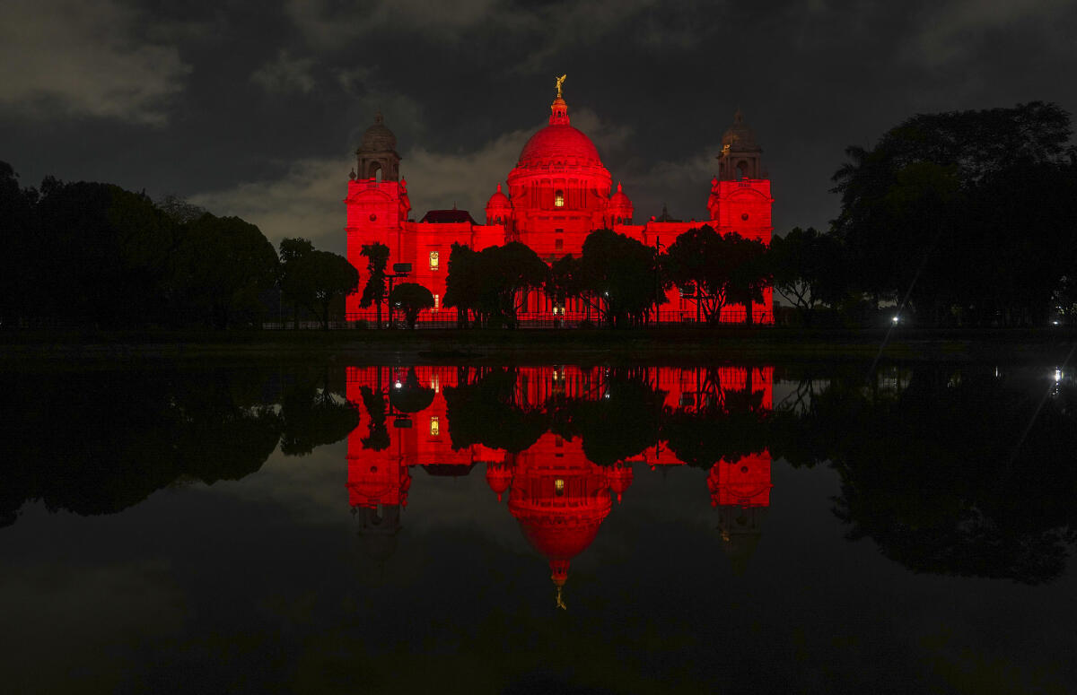 Victoria Memorial illuminated in red as part of Dyslexia Awareness month, showing solidarity and support, in Kolkata, West Bengal